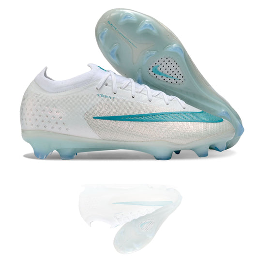 Botas de fútbol Nike Mercurial Vapor XVII Elite FG blancas con detalles turquesa, vista lateral y suela